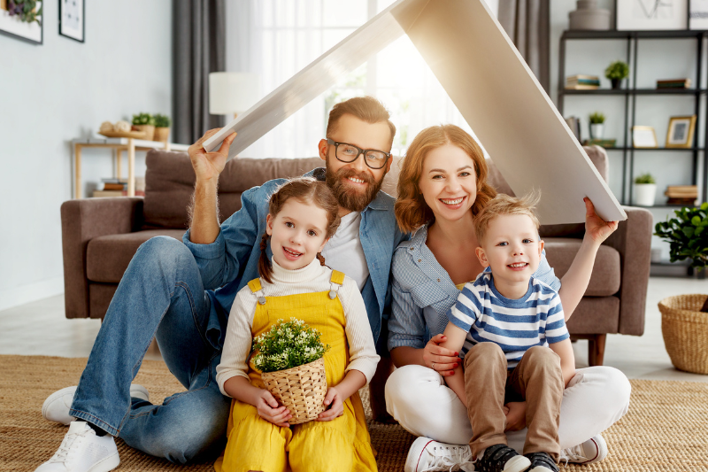 Family in a house under a cardboard roof